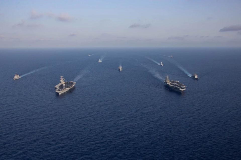 A photo of the USS Gerald R. Ford and Dwight D. Eisenhower Carrier Strike Groups sail together in the Eastern Mediterranean.