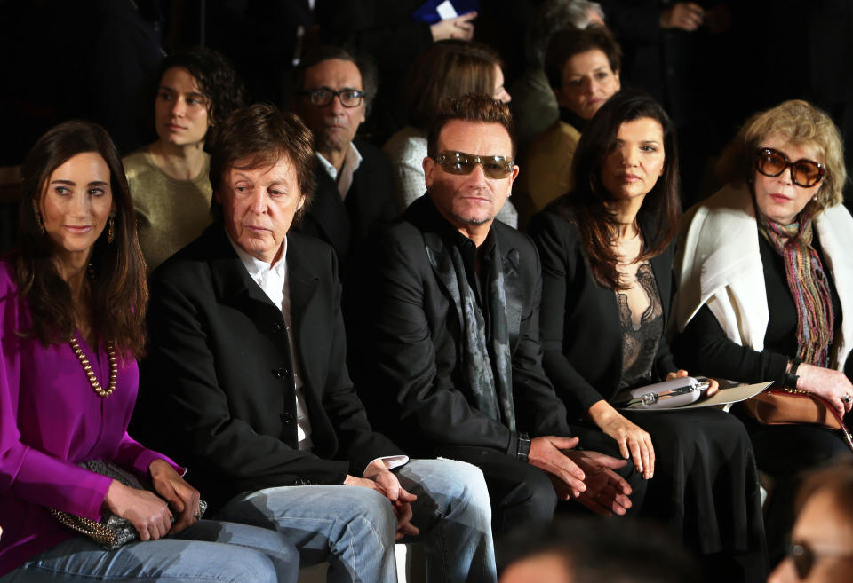 From left, Nancy Shevell, Sir Paul McCartney, Bono, Ali Hewson and Marianne Faithfull watch fashion designer Stella McCartney's Fall/Winter 2013-2014 ready to wear collection, in Paris, Monday, March, 4, 2013. (AP Photo/Thibault Camus)