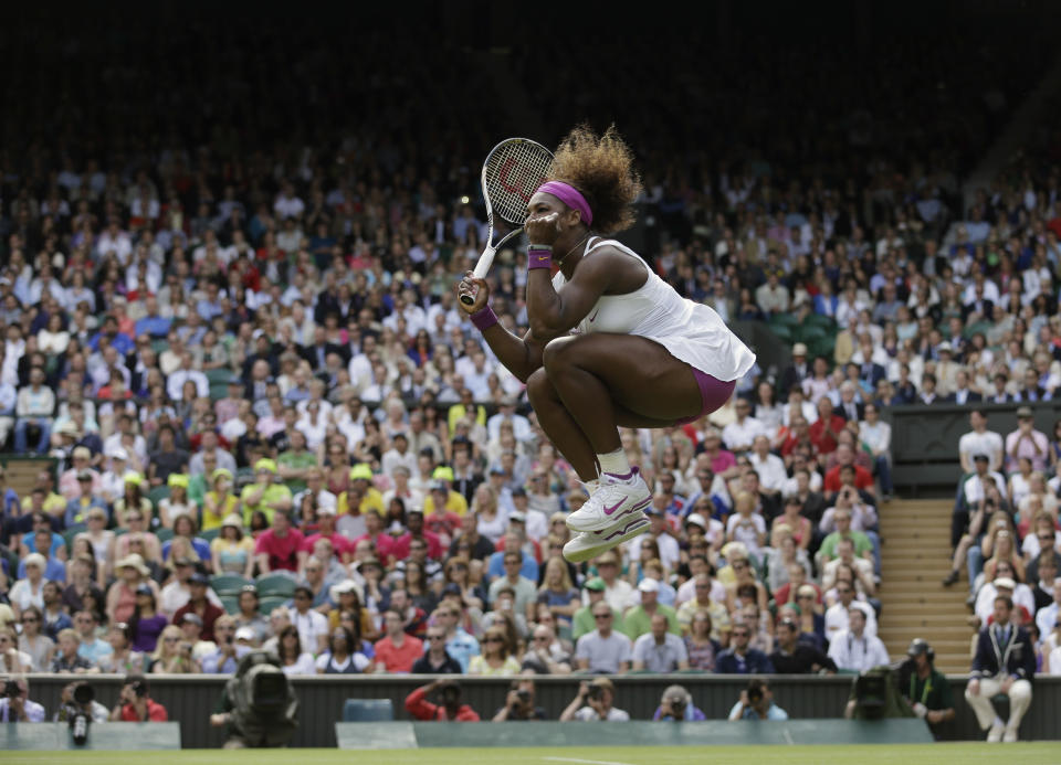 FILE - In this Saturday, June 30, 2012 file photo made by Associated Press photographer Anja Niedringhaus, Serena Williams of the United States reacts after winning against Zheng Jie of China during a third round women's singles match at the All England Lawn Tennis Championships at Wimbledon, England. Niedringhaus, 48, an internationally acclaimed German photographer, was killed and AP reporter Kathy Gannon was wounded on Friday, April 4, 2014 when an Afghan policeman opened fire while they were sitting in their car in eastern Afghanistan. (AP Photo/Anja Niedringhaus, File)