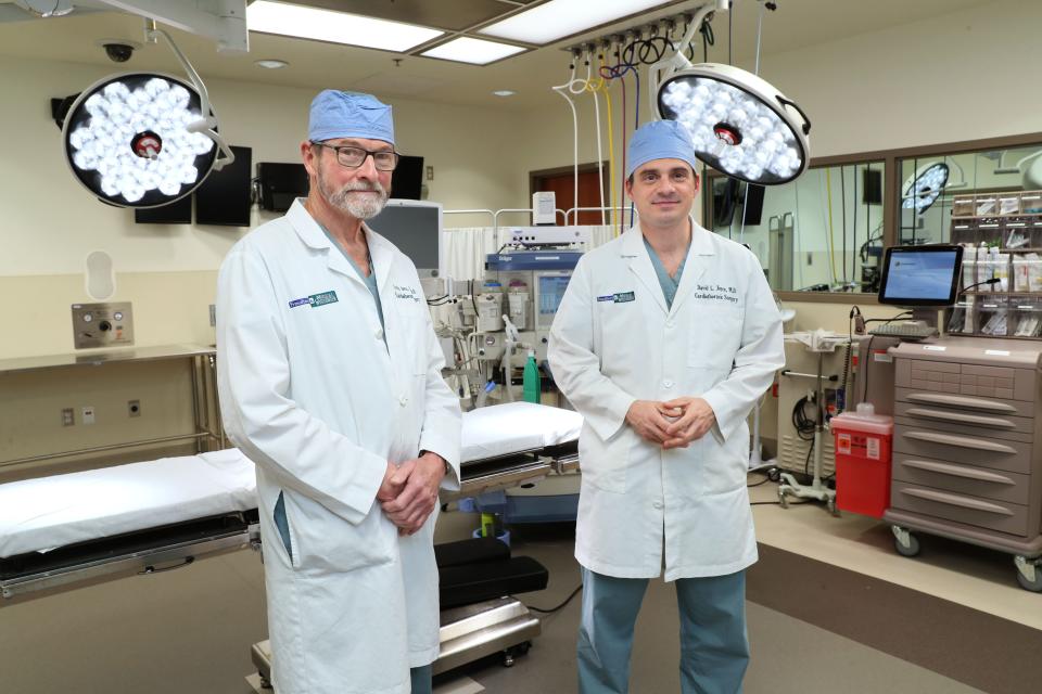 Lyle Joyce, left, and his son, David Joyce, both cardiothoracic surgeons, performed a lifesaving second heart transplant in March on Chuck Newman. Lyle Joyce also did the first transplant for Newman in 1988. The surgeons are standing in a simulation lab used for training those involved with surgery at Froedtert & the Medical College of Wisconsin.
