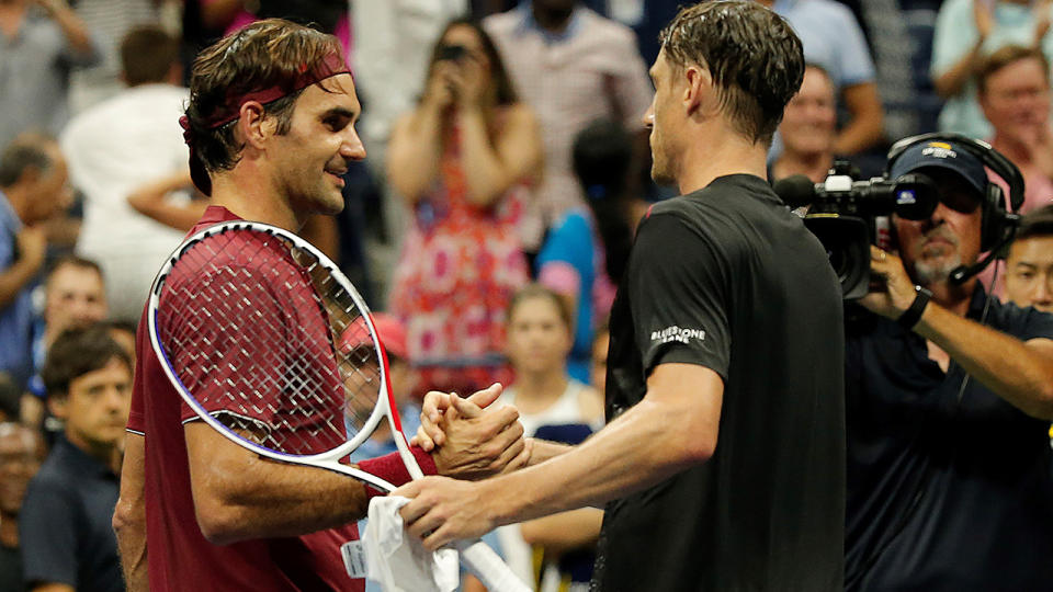 John Millman congratulates Roger Federer after defeating him. (Photo by Mohammed Elshamy/Anadolu Agency/Getty Images)