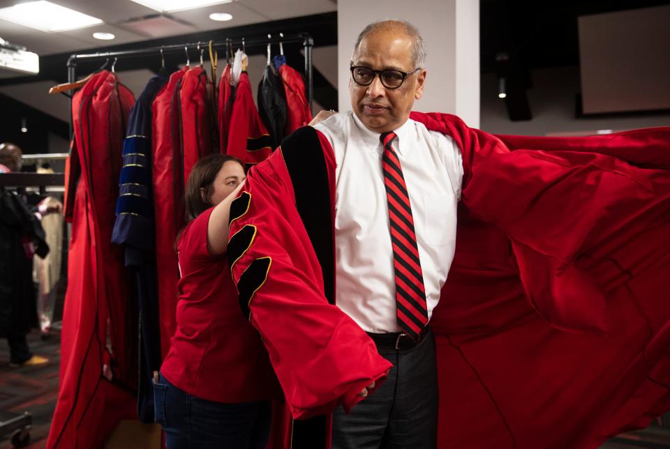 Neville Pinto, the 30th president of the University of Cincinnati gets ready for one of four graduations at Fifth Third Arena in the Shoemaker Center, Friday, April 29, 2022