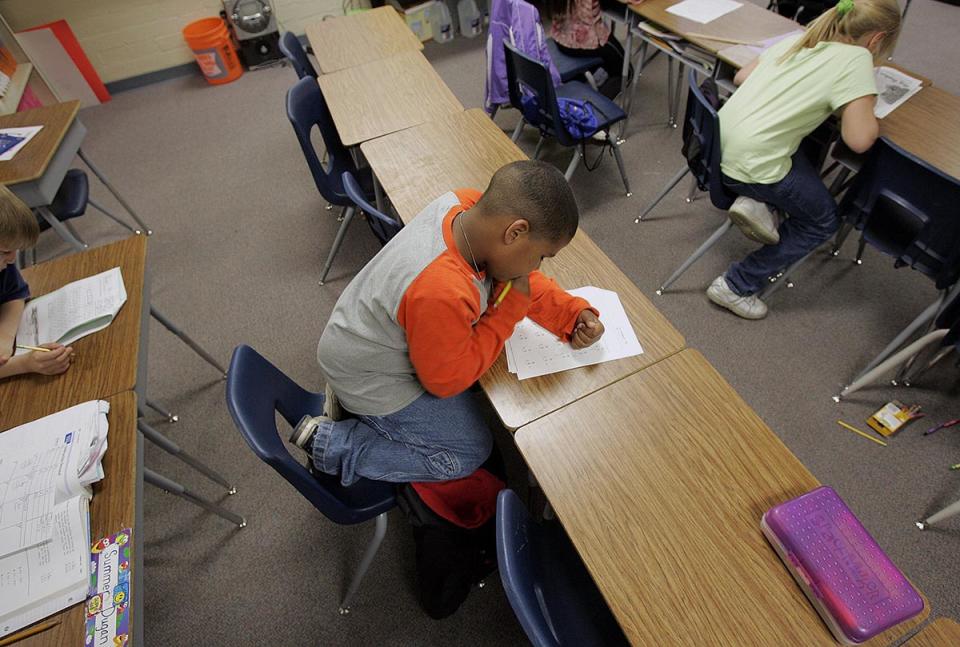 A third-grade student works on his math homework at an elementary school in Henderson, Nev. 