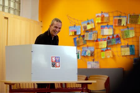 The leader of Czech Pirate Party Ivan Bartos fills out his ballot paper to vote in parliamentary elections in Prague, Czech Republic October 20, 2017. REUTERS/David W Cerny