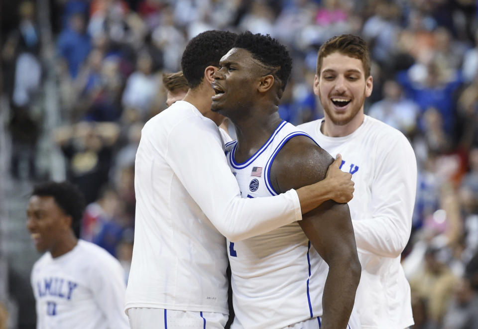 Duke's Zion Williamson, center, celebrates the team's 77-76 win over Central Florida in a second-round men's college basketball game in the NCAA Tournament in Columbia, S.C., Sunday, March 24, 2019. (AP Photo/Richard Shiro)