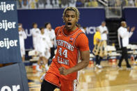 Illinois guard Adam Miller reacts to a basket against Michigan in the second half of an NCAA college basketball game in Ann Arbor, Mich., Tuesday, March 2, 2021. (AP Photo/Paul Sancya)