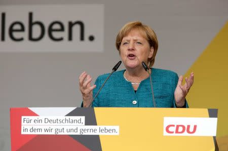 German Chancellor Angela Merkel, a top candidate of the Christian Democratic Union Party (CDU), speaks during the election rally in Annaberg-Buchholz, Germany August 17, 2017, ahead of the upcoming federal election. REUTERS/Matthias Schumann