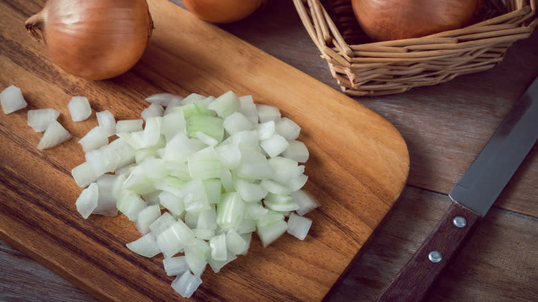 shopped onions on cutting board