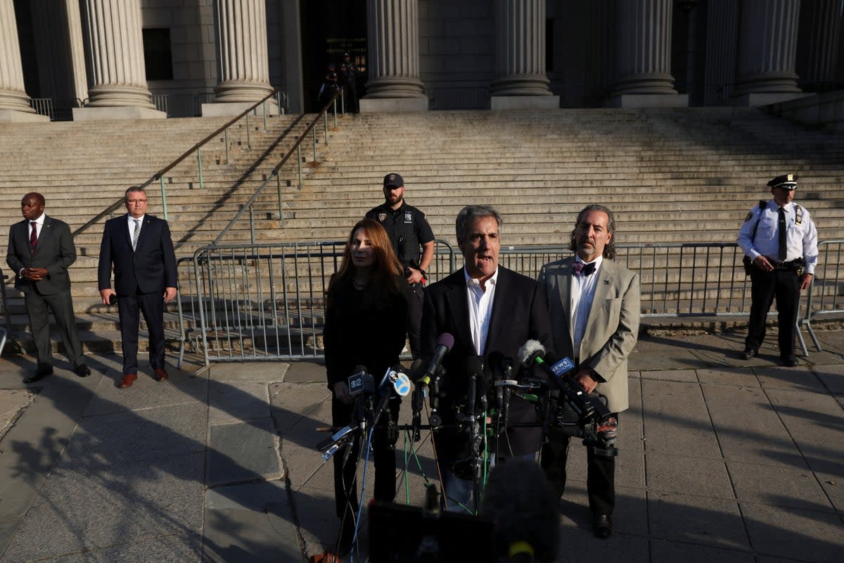 Michael Cohen speaks to reporters after two days of testimony in Donald Trump’s civil fraud trial in New York Supreme Court on 25 October. (REUTERS)