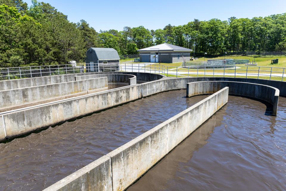 The private investment firm which took over ownership of the underused sewage treatment plant at Joint Base Cape Cod in September began operations Monday, a move the firm said is the first step in solving the region's  wastewater disposal problems.
