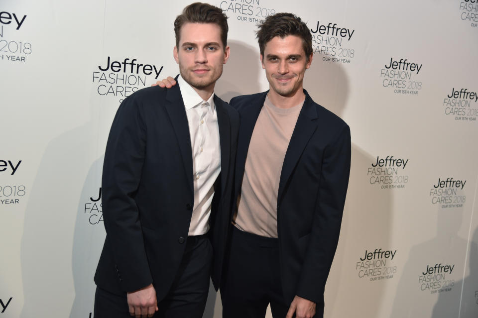 Antoni and Joey smiling at a media event