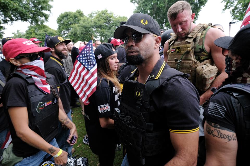 Proud Boys head Enrique Tarrio (center, wearing sunglasses at a rally last weekend in Portland, Oregon. (Photo: Anadolu Agency via Getty Images)