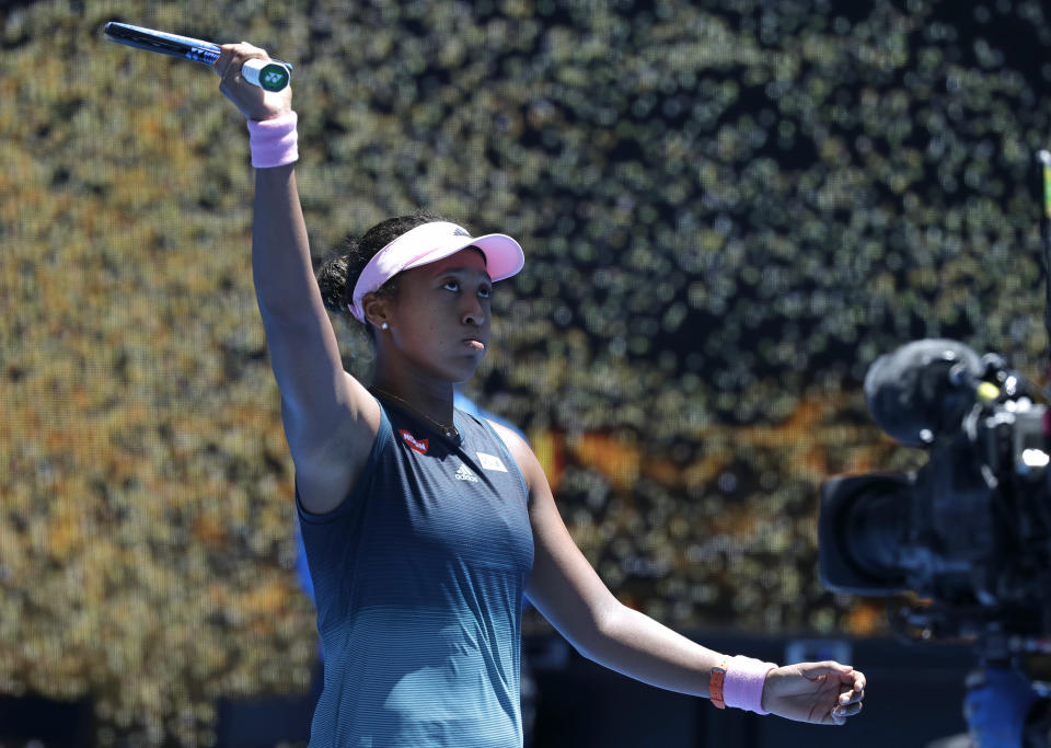 Japan's Naomi Osaka celebrates after defeating Latvia's Anastasija Sevastova during their fourth round match at the Australian Open tennis championships in Melbourne, Australia, Monday, Jan. 21, 2019. (AP Photo/Kin Cheung)