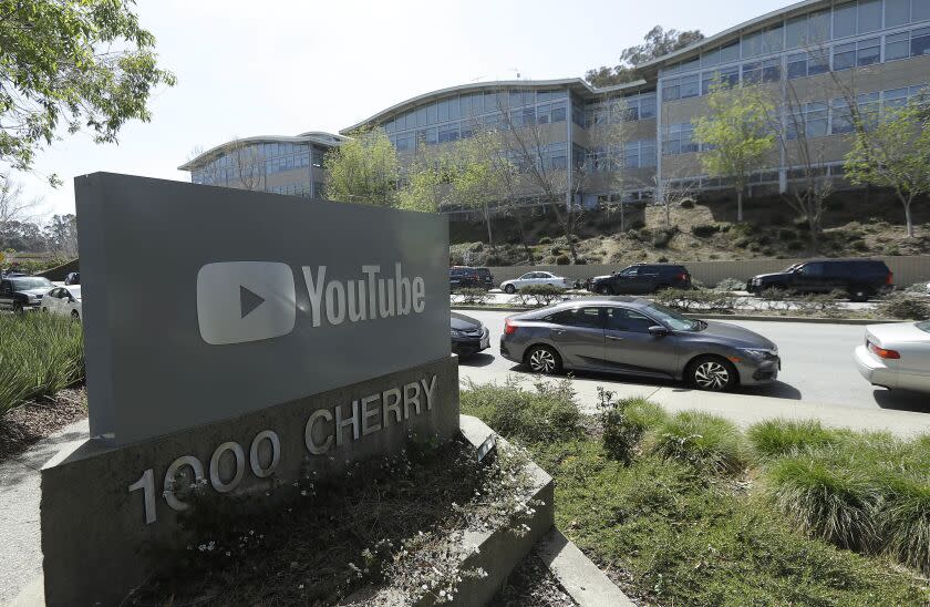 A YouTube sign is shown across the street from the company's offices in San Bruno, Calif., Tuesday, April 3, 2018. A woman opened fire at YouTube headquarters Tuesday, setting off a panic among employees and wounding several people before fatally shooting herself, police and witnesses said. (AP Photo/Jeff Chiu)