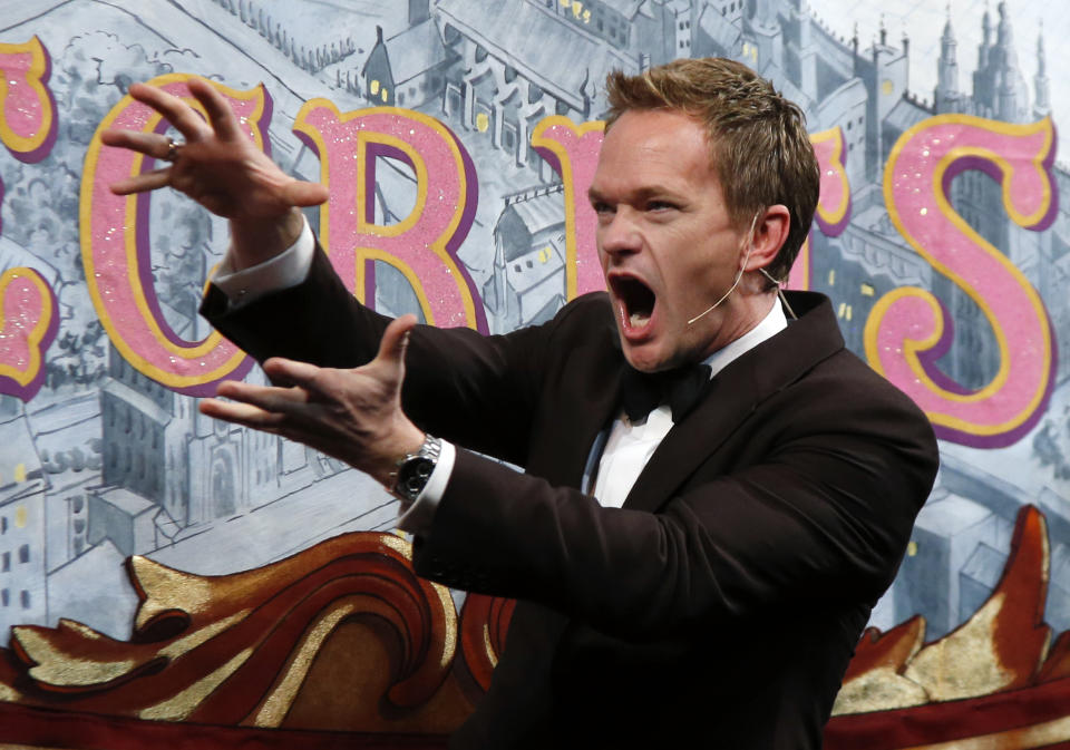 Actor Neil Patrick Harris acts onstage during his roast as Man of The Year by Harvard University's Hasty Pudding Theatricals in Cambridge, Mass., Friday, Feb. 7, 2014. (AP Photo/Elise Amendola)