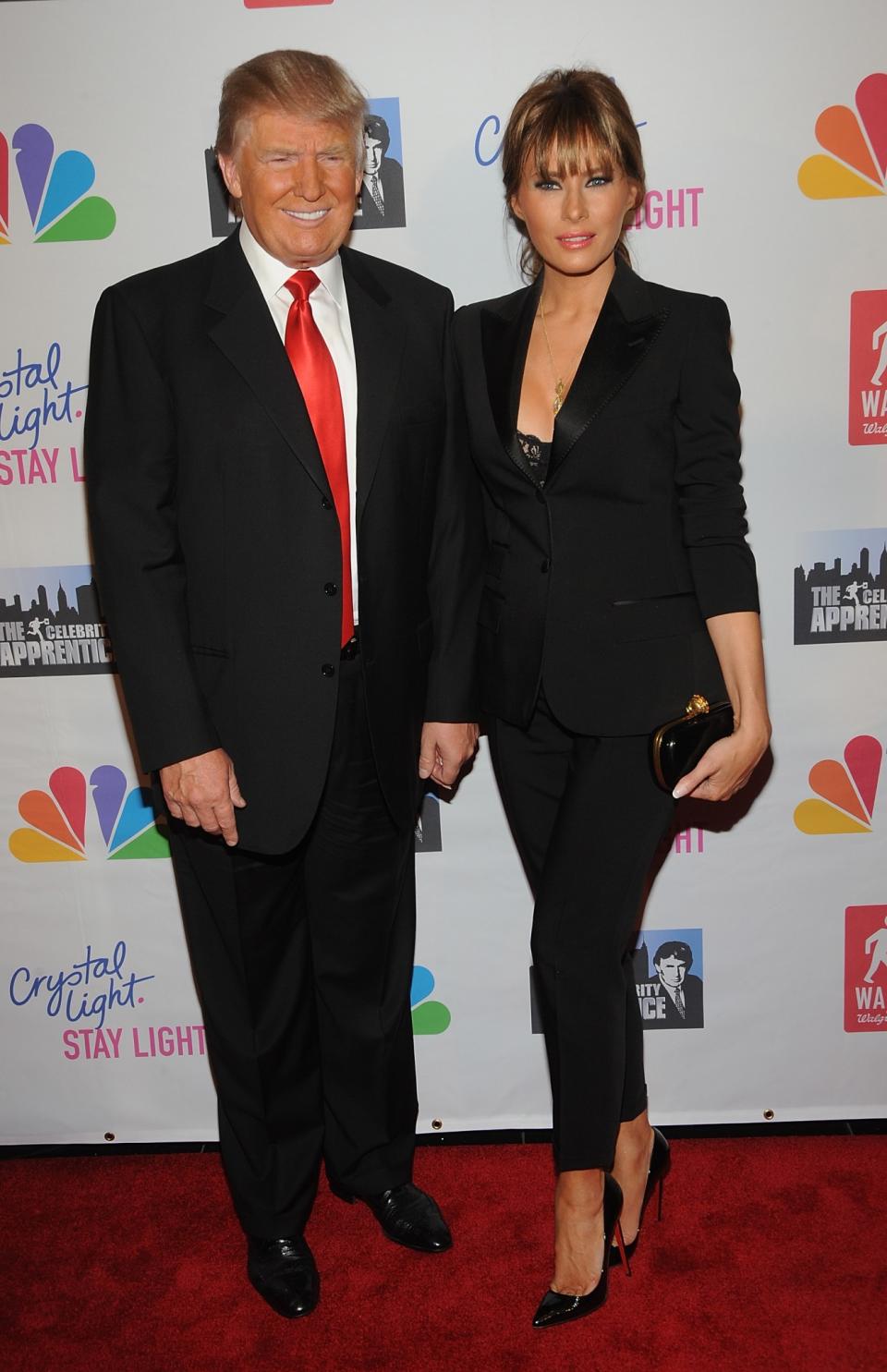 <p>For the live finale of <i>Celebrity Apprentice</i>, Melania fittingly chose a smart black suit, showing the hint of a lacy bra underneath. <i>[Photo: Getty]</i> </p>