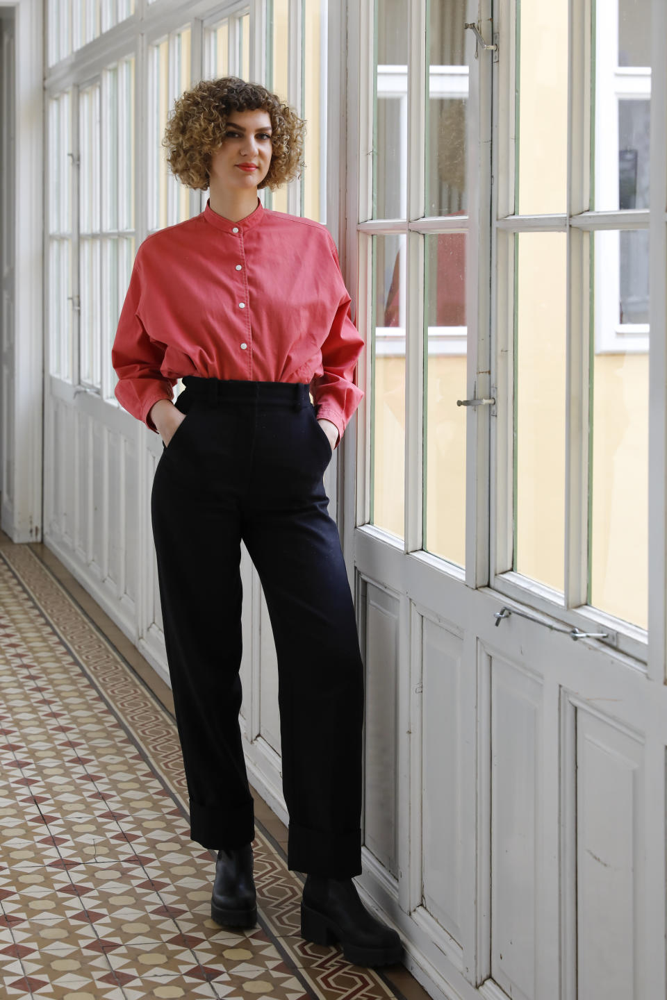 The sociologist Laura Wiesboeck poses for a photo in Vienna, Austria, Monday, May 17, 2021. Austria is one of the few European Union countries where the number of women killed is higher than the number of men. The recent high-profile cases have led to widespread protests, demands for government intervention and condemnations from top politicians. (AP Photo/Lisa Leutner)