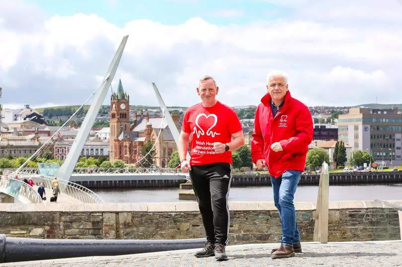 Alex with Fearghal McKinney, head of BHF NI, is walking the equivalent distance of the length and breadth of Ireland during July and August