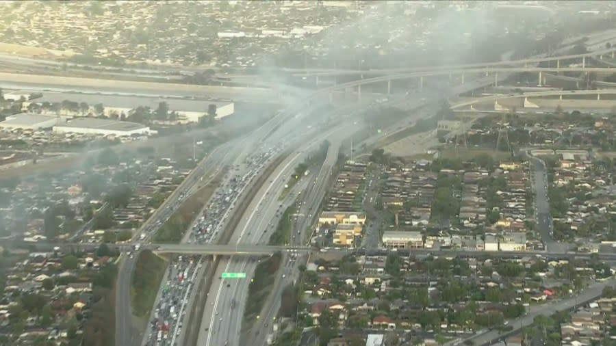 A burning van on the 105 Freeway in the City of Paramount caused delays for commuters early Monday morning. (Sky5)