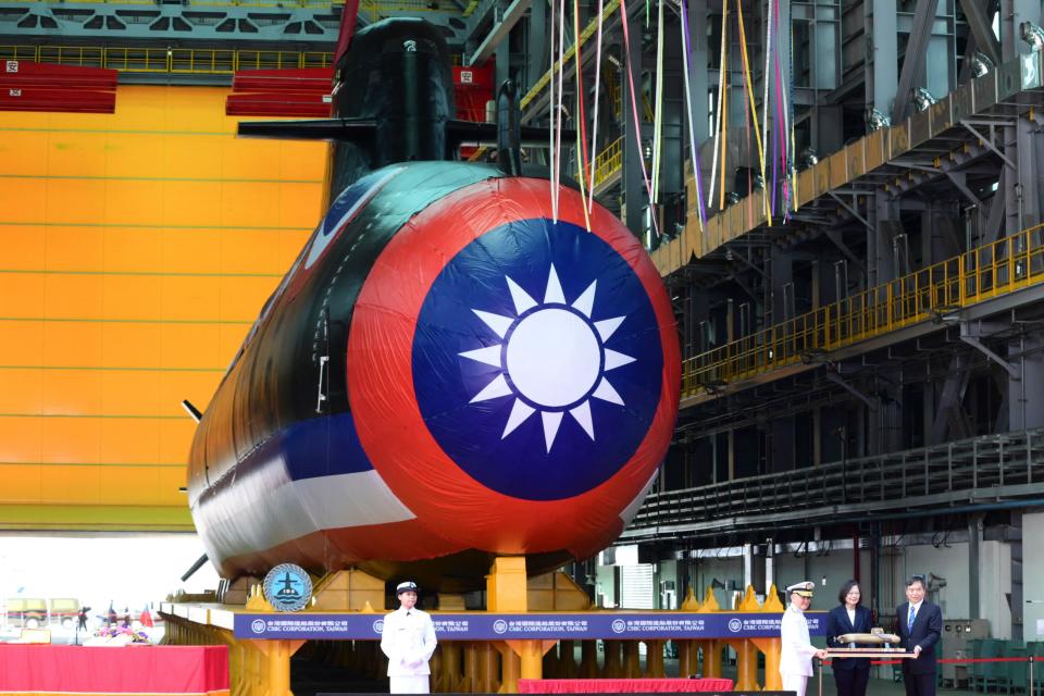 Taiwan President Tsai Ing-wen (2nd R) receives a submarine model in front of Taiwan's first locally built submarine "Narwhal" during the vessel's unveiling ceremony at the CSBC Corporation shipbuilding company in Kaohsiung on September 28, 2023.