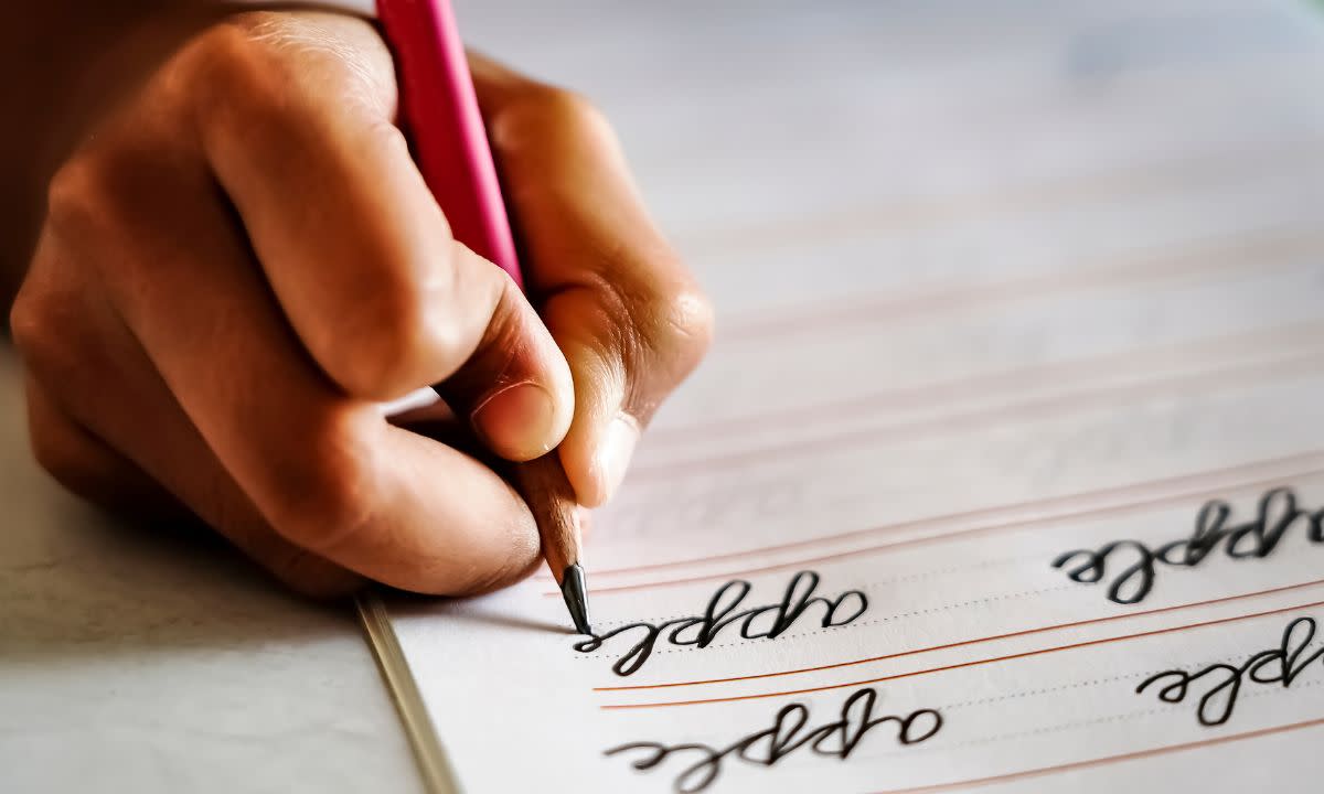 This is a photo of a student writing in cursive