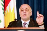 Iraqi Prime Minister Haider al-Abadi addresses the media during a joint news conference with Iraqi Kurdish President Massoud Barzani in Arbil, April 6, 2015. REUTERS/Azad Lashkari/File Photo