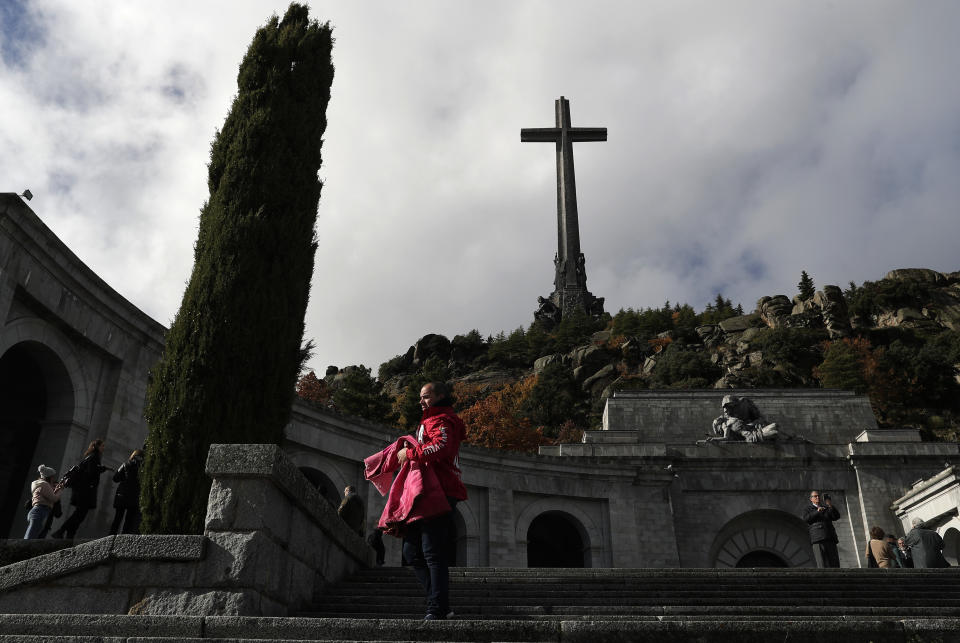 People visit The Valley of the Fallen monument near El Escorial, outside Madrid, Tuesday, Nov. 20, 2018, where the basilica houses the tomb of former Spanish dictator Francisco Franco. Tuesday marks the 43rd anniversary of the death of Dictator Gen. Francisco Franco. (AP Photo/Manu Fernandez)