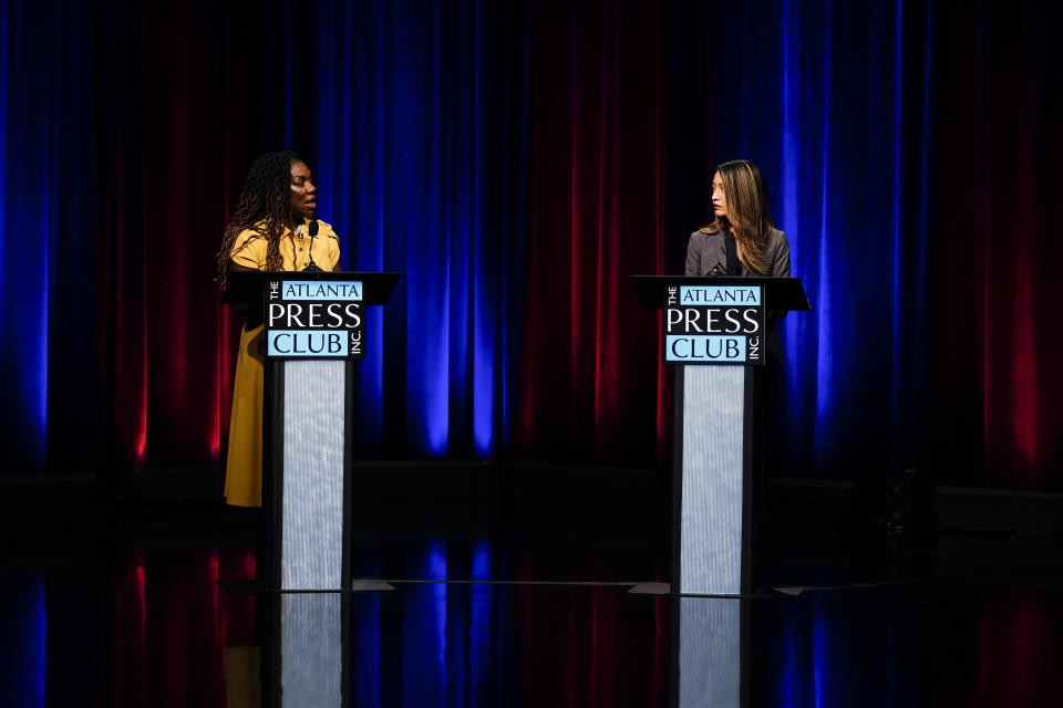 Former state Rep. Dee Dawkins-Haigler, left, and Georgia State Rep. Bee Nguyen, right, participate in Georgia's secretary of state democratic primary election runoff debates on Monday, June 6, 2022, in Atlanta. (AP Photo/Brynn Anderson)