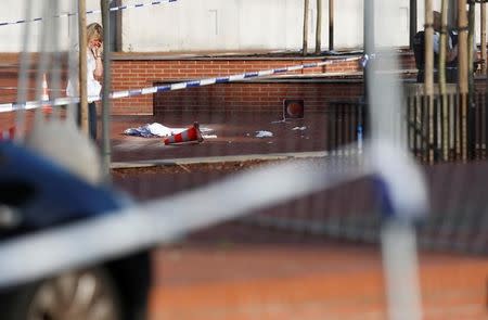 View of the site where a machete-wielding man injured two female police officers before being shot outside the main police station in Charleroi, Belgium, August 6, 2016. REUTERS/Francois Lenoir