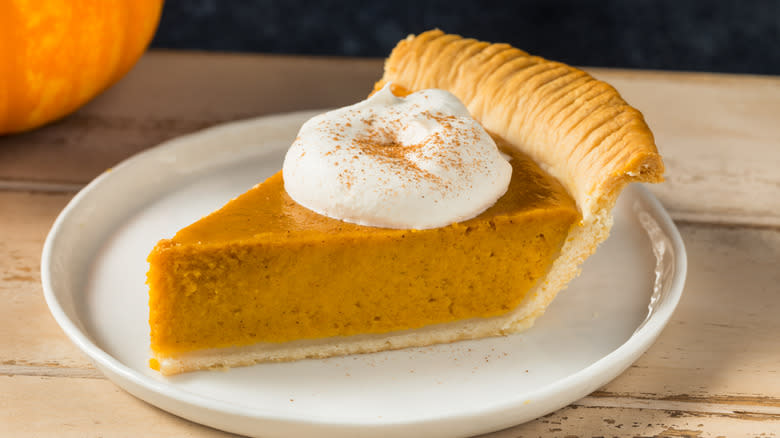 Pumpkin pie slice on plate