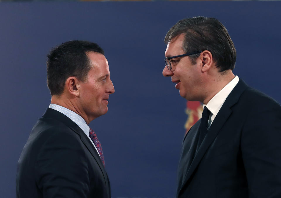 U.S. President Donald Trump's envoy for the Kosovo-Serbia dialogue, Ambassador Richard Grenell, left, speaks with Serbian President Aleksandar Vucic after a press conference in Belgrade, Serbia, Friday, Jan. 24, 2020. Grenell is meeting Serbian President Vucic in order to move the dialogue and normalize relations between the two sides.(AP Photo/Darko Vojinovic)