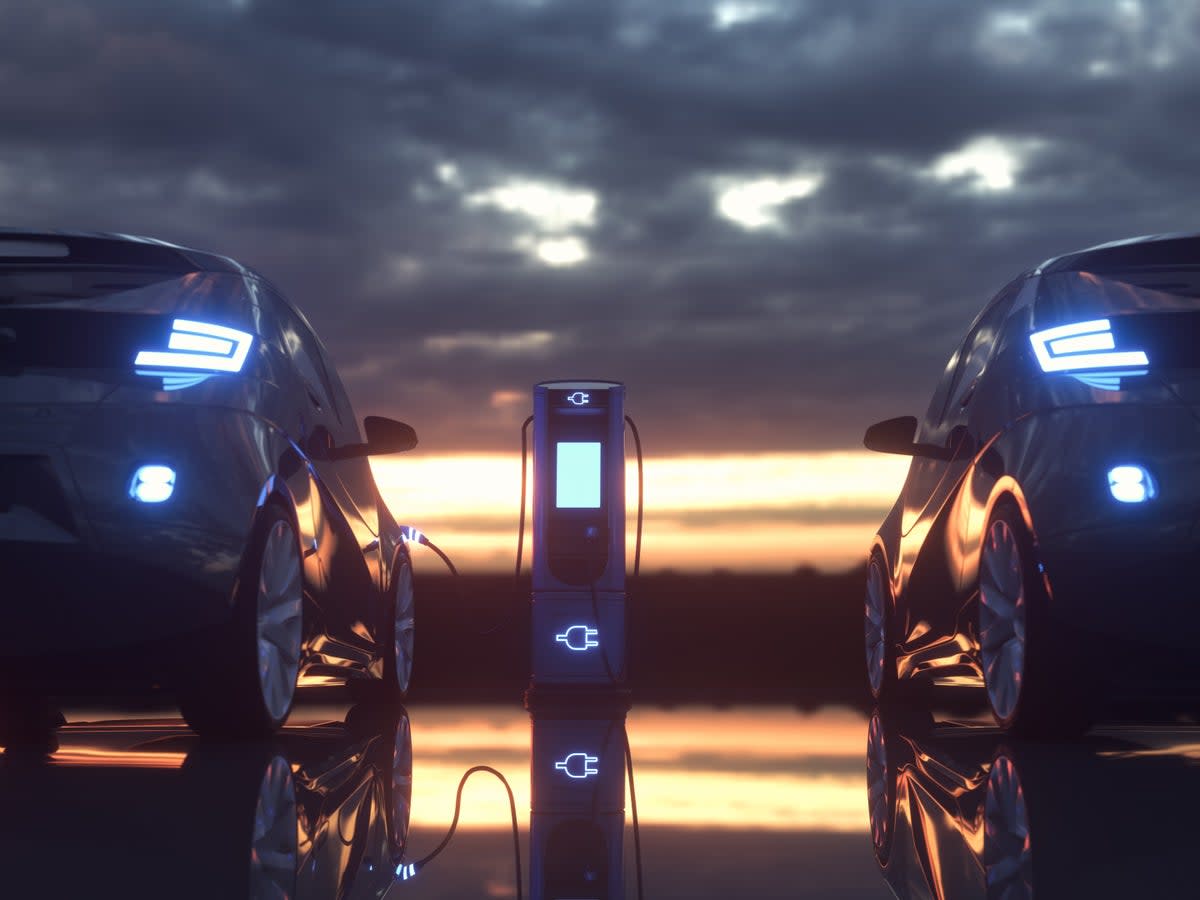 Electric cars plugged in at a charging station (Getty/iStockphoto)