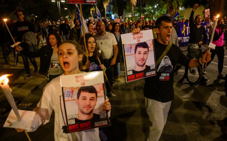 People march in protest in Tel Aviv demanding the release of hostages