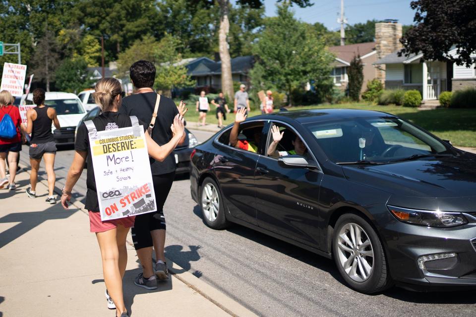 Aug 23, 2022; Columbus, Ohio, USA; Teachers and other CEA union members, and supporters march up and down Henderson Rd. outside of Whetstone High School on day two of the strike. 