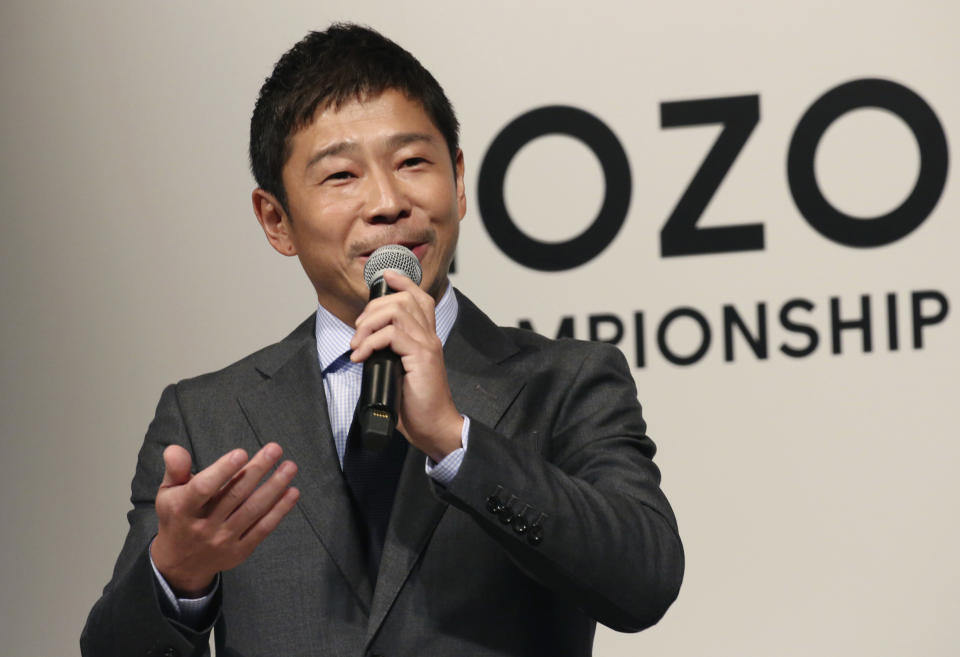 ZOZO Inc. President Yusaku Maezawa speaks during a press conference on the PGA Tour in Tokyo, Tuesday, Nov. 20, 2018. The PGA Tour will hold its first official tournament, the Zozo Championship, in Japan. And the main sponsor of next year's event, Japanese billionaire Maezawa, is calling the tournament a kind of "moonshot" for golf in his country. Maezawa was announced earlier this year as the first commercial passenger to attempt a flyby around the moon. (AP Photo/Koji Sasahara)