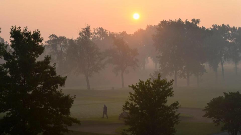 Thick smoke from fireworks fired hours earlier hung in the air over Brookridge Golf and Fitness in Overland Park Sunday morning, July 5, 2020. The National Weather Service issued a special weather advisory warning of unhealthy conditions due to an air inversion that kept the smoke close to the ground.