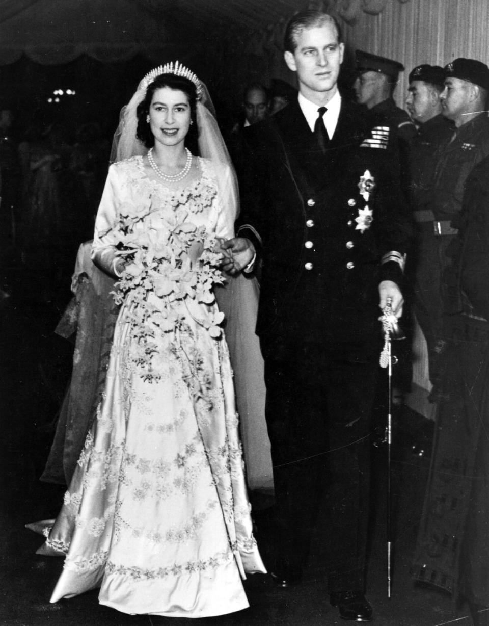 <p>When Elizabeth married in 1947, her wedding dress was designed to be a symbol of the nation, royal wedding gown curator Joanna Marschner told <em><a href="https://go.redirectingat.com?id=74968X1596630&url=https%3A%2F%2Fnews.nationalgeographic.com%2Fnews%2F2011%2F04%2Fpictures%2F110428-royal-wedding-dress-kate-middleton-prince-william-gown-designed%2F&sref=https%3A%2F%2Fwww.harpersbazaar.com%2Fcelebrity%2Flatest%2Fg27683101%2Froyal-outfits-hidden-meanings%2F" rel="nofollow noopener" target="_blank" data-ylk="slk:National Geographic;elm:context_link;itc:0" class="link ">National Geographic</a></em>. With everything still rationed in post-WWII Britain, the idea was to send <a href="https://www.rct.uk/about/news-and-features/the-queens-wedding-and-coronation-dresses-to-be-displayed-together-for-the#/" rel="nofollow noopener" target="_blank" data-ylk="slk:a message of national renewal and hope;elm:context_link;itc:0" class="link ">a message of national renewal and hope</a> for the future. </p>