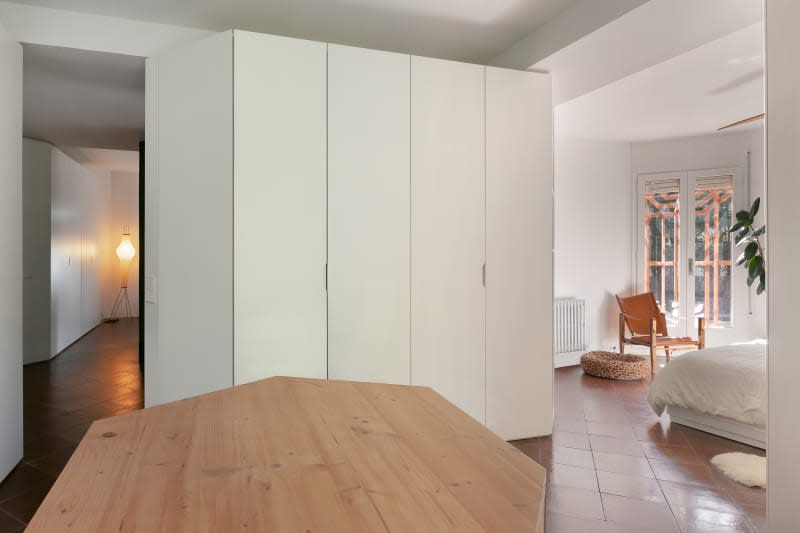 Closet in tiled bedroom.