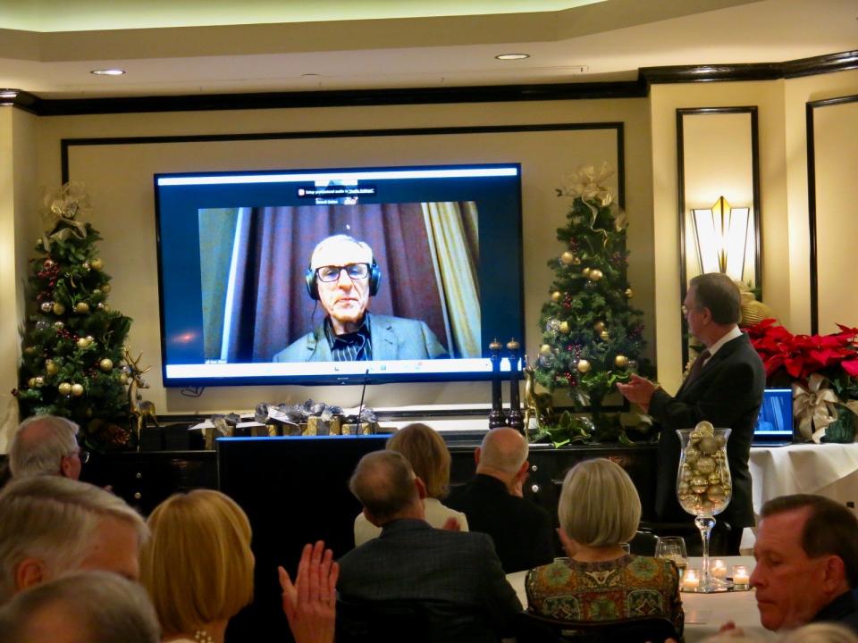 Distinguished Service Award winner Dr. Gazi Zibari, on a medical mission trip to Kurdistan Iraq, joins the group via Zoom call.