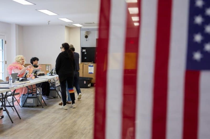 People check in to vote at the Connie Norman Transgender Empowerment Center in Los Angeles on Super Tuesday. Voters in 16 states and territories cast their ballots for presidential candidates in the 2024 primary elections. Photo by Allison Dinner/EPA-EFE