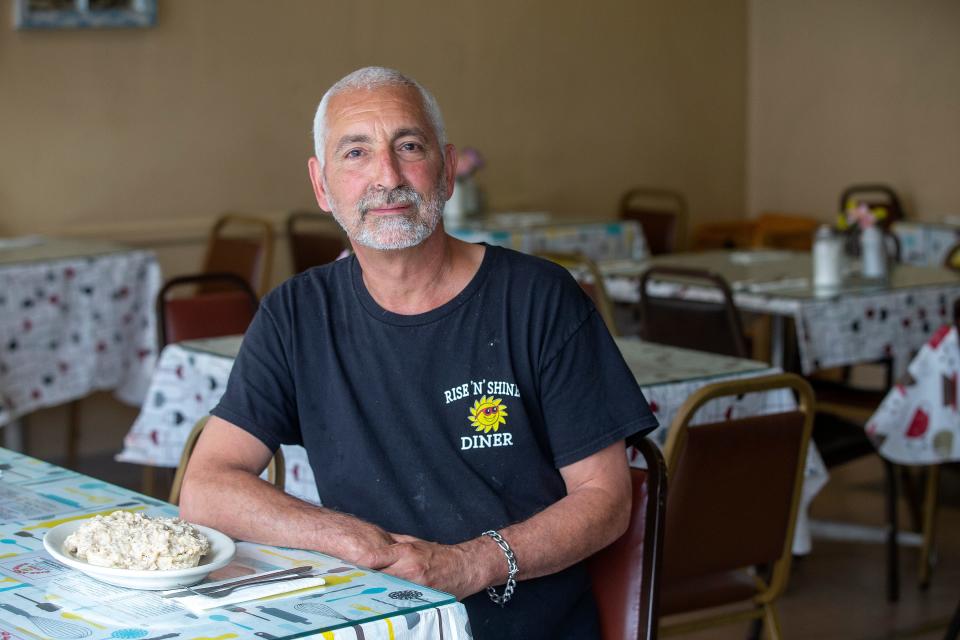 Sal Martorana, owner of Rise N Shine Diner, an Eatontown-based breakfast spot since 1987, displays his signature dish, Southern-style biscuits and sausage gravy, in Eatontown, NJ Friday, June 3, 2022.