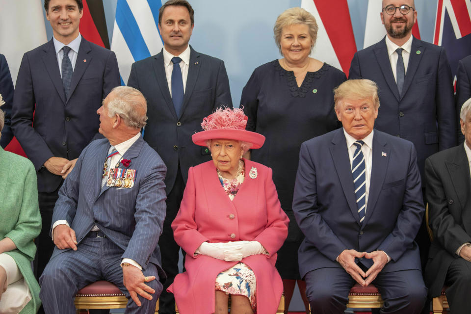 Britain's Queen Elizabeth II, accompanied by Prince Charles, poses for a formal photograph with leaders of the other Allied Nations ahead of the National Commemorative Event commemorating the 75th anniversary of D-Day, in Portsmouth, England, Wednesday June 5, 2019. Back row from left: Canada PM Justin Trudeau, Luxembourg PM Xavier Bettel, Norway PM Erna Solberg, Belgium PM Charles Michel. Front row from left: Britain's Prince Charles, Queen Elizabeth II, and US President Donald Trump. Commemoration events are marking the 75th Anniversary of the D-Day landings when Allied forces stormed the beaches of Normandy in northern France during World War II.(Jack Hill/Pool via AP)