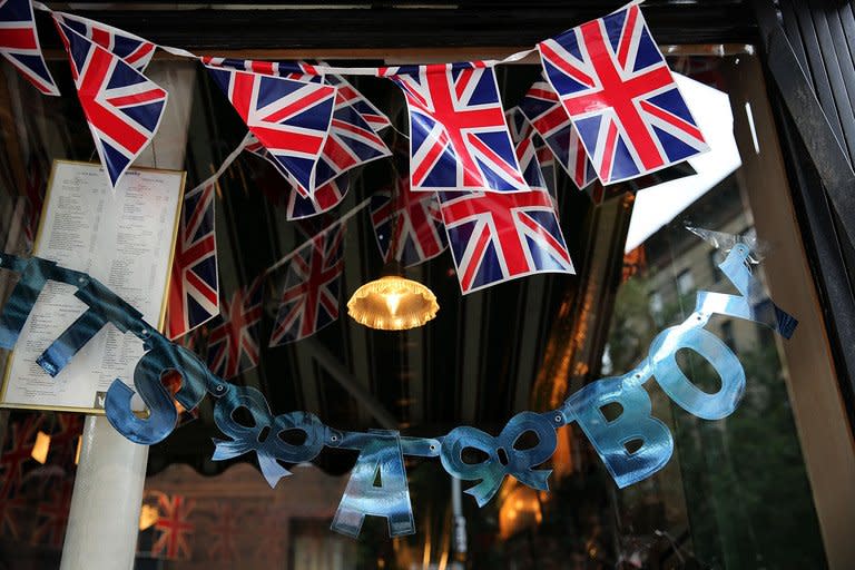 A sign in the window of British restaurant and grocery Tea and Sympathy reads "It's A Boy" as it celebrates the birth of Catherine, Duchess of Cambridge, and her husband Prince William's first child on July 22, 2013 in New York City