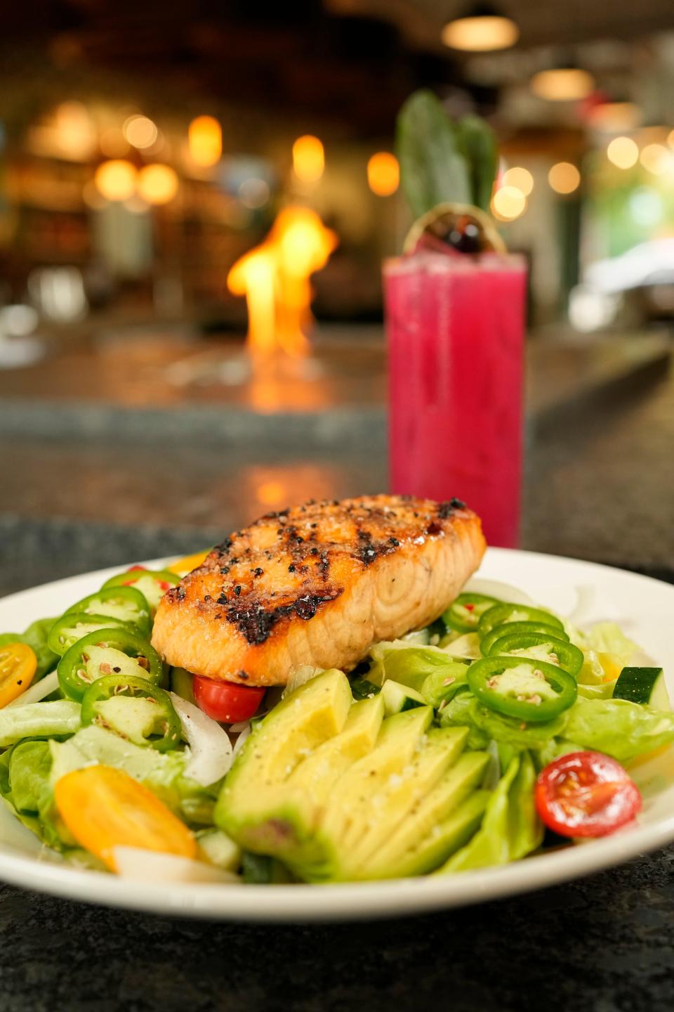 An Island Salad with grilled salmon and a Beet Daze cocktail from Kona Craft Kitchen
