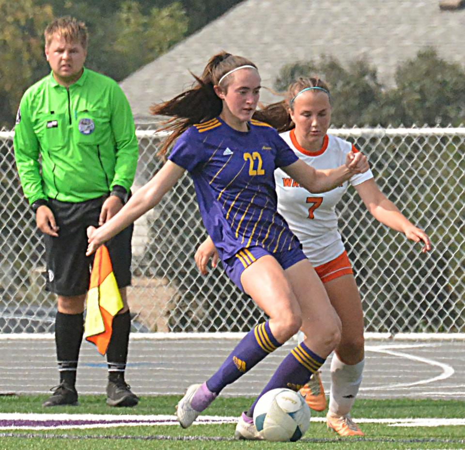 Watertown's Claire Schochenmaier (22) clears the ball in front off Sioux Falls Washington's Isabella Messenbrink during their high school girls soccer match on Saturday, Sept. 23 at Allen Mitchell Field in Watertown.