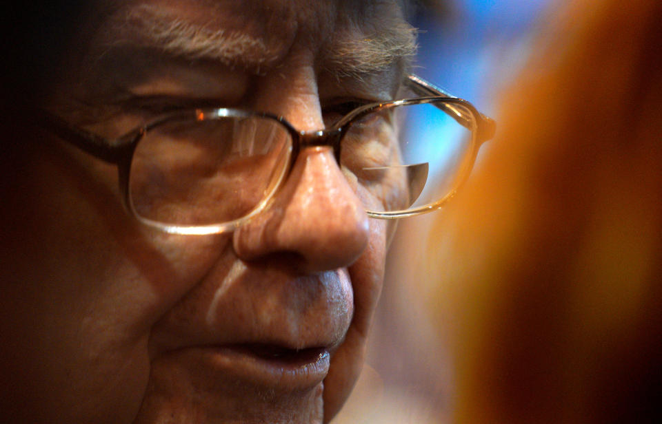 Warren Buffett, CEO of Berkshire Hathaway Inc, talks to a reporter in the exhibit hall at the company&#39;s annual meeting in Omaha, Nebraska, U.S., May 5, 2018. REUTERS/Rick Wilking