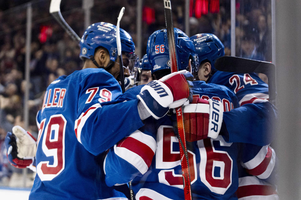 New York Rangers players celebrate after right wing Kaapo Kakko (24) scored against the Dallas Stars during the second period of an NHL hockey game on Tuesday, Feb. 20, 2024 in New York. (AP Photo/Peter K. Afriyie)