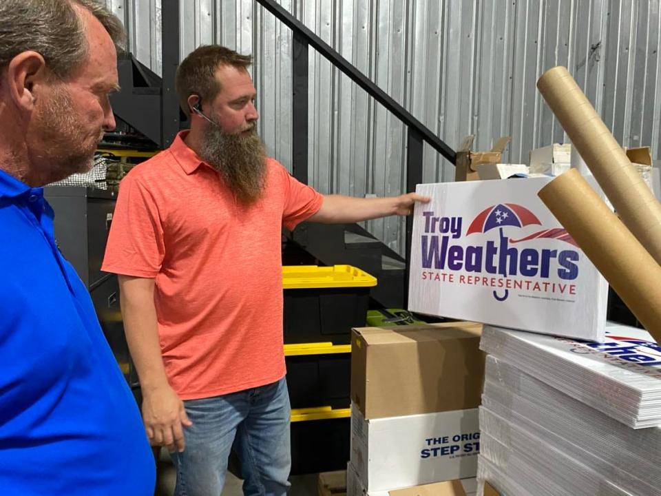 Republican primary candidate Troy Weathers of Cleveland talks with Tim Emerson, owner of DuraPlaq about campaign sign design at the DuraPlaq printing facility in Cleveland, Tennessee.