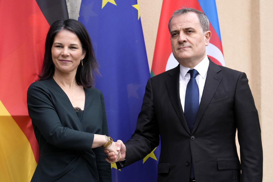 CORRECTS DATE German Foreign Minister Annalena Baerbock, left, welcomes Azerbaijan's Foreign Minister Jeyhun Bayramov for peace talks in Berlin, Germany, Wednesday, Feb. 28, 2024. Germany sought to move forward talks on a peace treaty between Armenia and Azerbaijan on Wednesday, welcoming the two countries' foreign ministers to Berlin. (AP Photo/Ebrahim Noroozi)