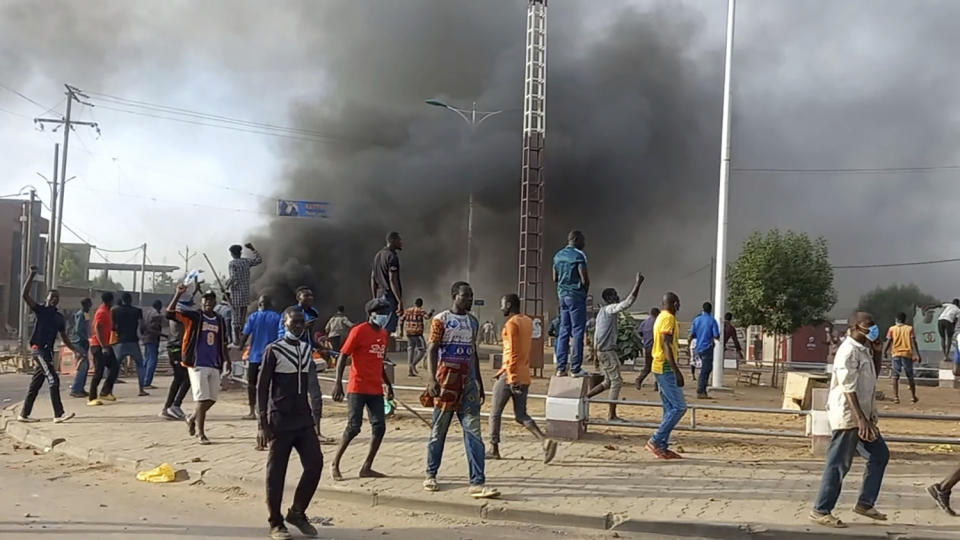 Anti-government demonstrators set a barricade on fire during clashes in N'Djamena, Chad, Thursday Oct. 20, 2022. Chadian security forces have opened fire on anti-government demonstrators in the country's two largest cities killing at least 60 people, the government spokesman and a morgue official said. Authorities imposed a curfew after Thursday's violence, which came amid protests in the central African nation against interim leader Mahamat Idriss Deby's two-year extension of power. (AP Photo)